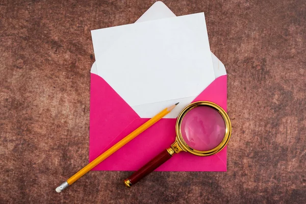 Letter With Envelope And Magnifying Glass Presenting Business Research.