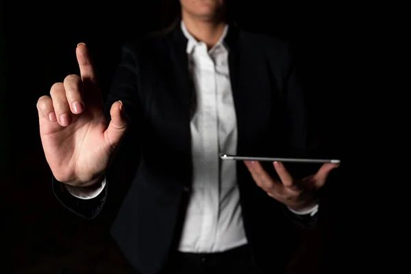 Businesswoman Holding Tablet And Pointing With One Finger On Important News