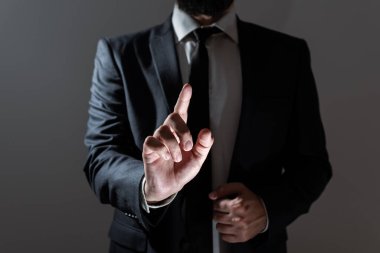 Businessman In Suit Pointing With One Finger On Important Message.