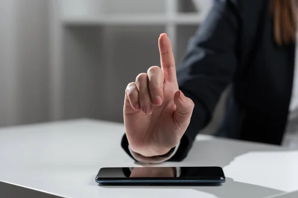 Woman Pointing With One Finger On Important Ideas On Desk With Phone.