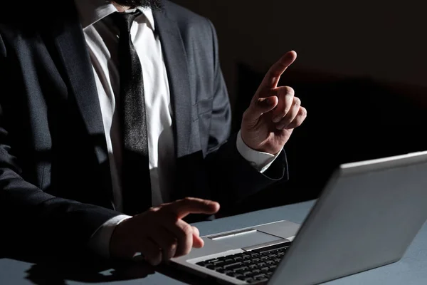 Man Pointing With Two Fingers On Important Information Sitting On Desk.