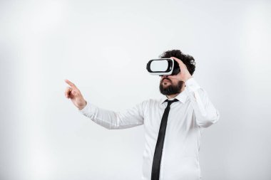 Man Wearing Vr Glasses And Pointing On Important Messages With One Finger.