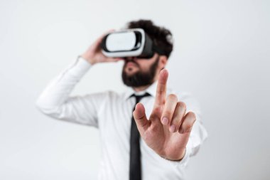 Man Wearing Vr Glasses And Pointing On Important Messages With One Finger.