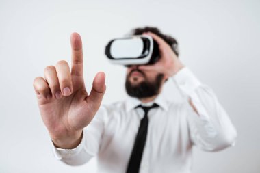 Man Wearing Vr Glasses And Pointing On Importantt Messages With One Finger.