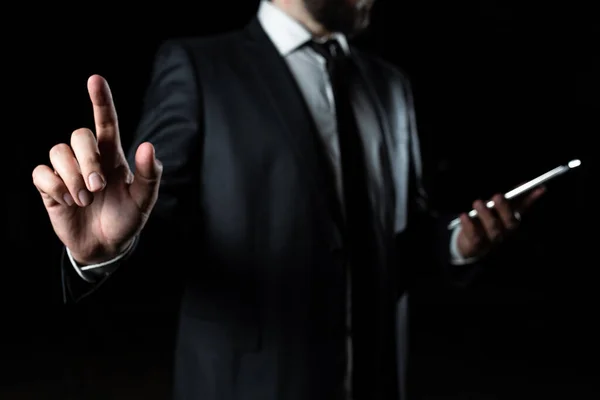 Businessman Holding Phone And Pointing With One Finger On Important Message
