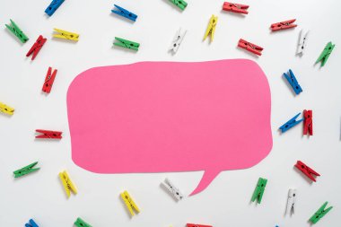 Colorful Pegs Placed Around Speech Bubble With Important Information.