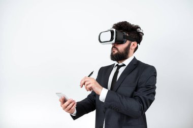 Man Holding Mobile Phone, Wearing Vr Glasses And Pointing On New Idea.