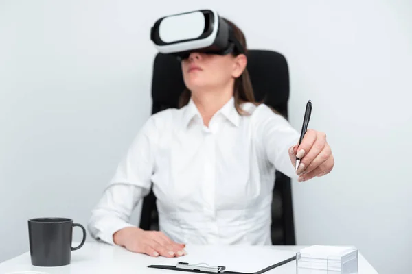 Woman Wearing Goggles And Learning Skill With Virtual Reality Simulator.