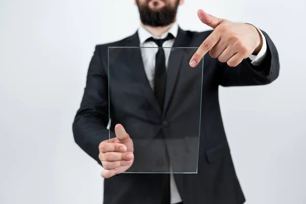 Businessman Pointing At Transparent Glass And Promoting The Brand.