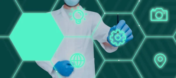 Doctor Pointing Pen On Digital S In Hexagon Showing Modern Technology.