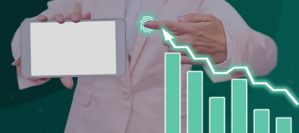 Businessman Holding A Tablet And Pointing On Crucial Data Charts In A Meeting.