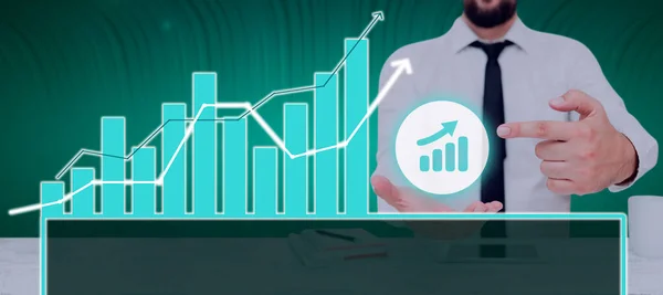 Businessman Pointing Chart Showing Crucial Diagrams Data —  Fotos de Stock
