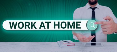 Handwriting text Work At Home, Word for Freelance job working on your house convenient technology Man Holding A Tablet Projecting A Camera Showing Creative Photography.