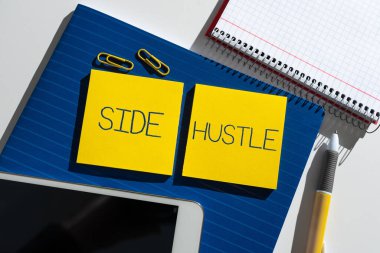 Text sign showing Side Hustle, Word Written on way make some extra cash that allows you flexibility to pursue Important News Presented On Two Sticky Notes On Desk With Mobile Phone.