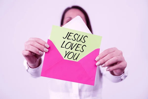 Text sign showing Jesus Loves You, Business concept Believe in the Lord To have faith religious person Woman Holding Letter And Envelope Sending Important Information.