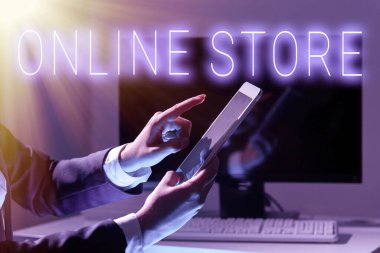 Conceptual caption Online Store, Word for A website that offers items for sale and accept credit cards Businesswoman Holding Tablet And Pointing With One Finger On Important News