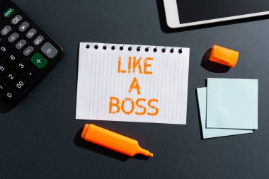 Handwriting text Like A Boss, Conceptual photo Acting as if you are the one giving orders in job or situation Late News Written On Paper On Desk With Marker,Notes, Tablet And Calculator
