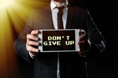 Hand writing sign Don T Give Up, Word Written on Keep trying until you succeed follow your dreams goals Businessman Presenting Important Informations On Phone Screen.
