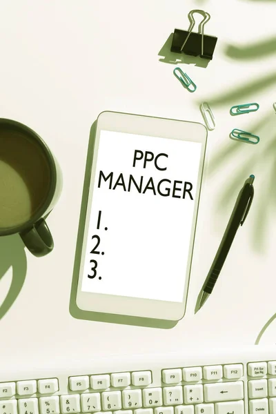 Inspiration showing sign Ppc Manager, Word for which advertisers pay fee each time one of their ads is clicked Mobile Phone Screen With Important Message On Desk With Coffee And Keyboard