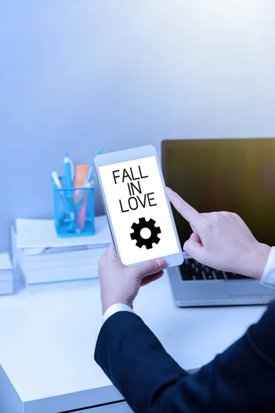 Text showing inspiration Fall In Love, Business concept Feeling loving emotions about someone else Romance Happiness Businesswoman Holding Tablet And Pointing With One Finger On Important News