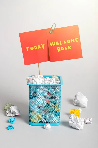 Sign displaying Welcome Back, Business approach Warm Greetings Arrived Repeat Gladly Accepted Pleased Case Full Of Paper Wraps And Two Important Messages Pinned On Stick.