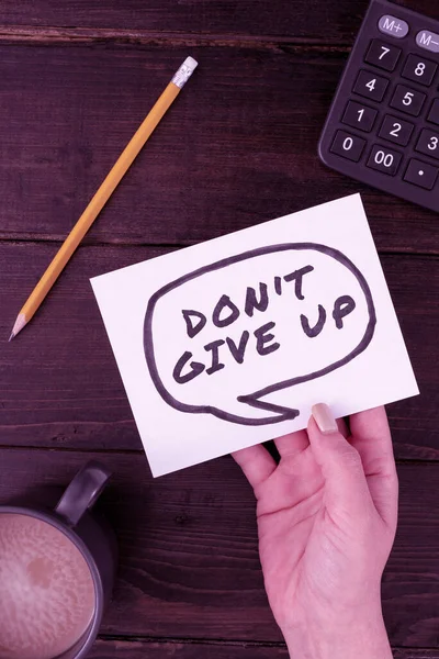 Conceptual display Don T Give Up, Conceptual photo Keep trying until you succeed follow your dreams goals Hand Of Woman With Thought Bubble Paper With Coffee Cup And Stationery.