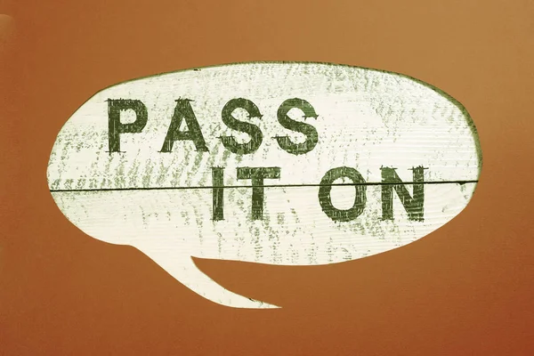 Sign displaying Pass It On, Business approach Share something with others Spread the word sharing talking Cropped Speech Bubble With Important Message Placed On Floor.