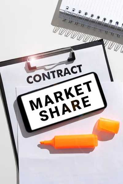 Conceptual caption Market Share, Word Written on The portion of a market controlled by a particular company Tablet With Important Message Over Marker, Clipboard And Piece Of Paper.