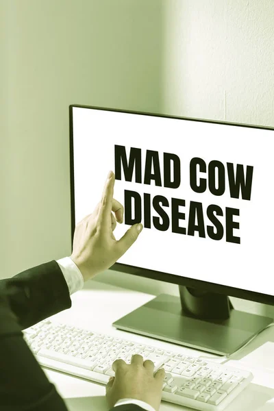 Text caption presenting Mad Cow Disease, Concept meaning Neurodegenerative lethal disease contagious eating meat Woman Typing Updates On Lap Top And Pointing New Ideas With One Finger.