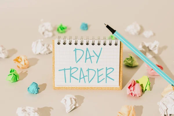 Hand writing sign Day Trader, Word for A person that buy and sell financial instrument within the day Important Message Presented On Notepad With Paperwraps All Aroud.