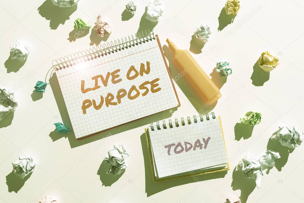 Conceptual display Live On Purpose, Internet Concept Have a goal mission motivation to keep going inspiration Notebooks With Important Messages Surrounded By Paper Wraps.