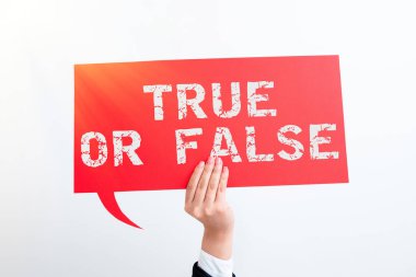 Writing displaying text True Or False, Business overview Decide between a fact or telling a lie Doubt confusion Businesswoman Holding Speech Bubble With Important Messages With One Hand.