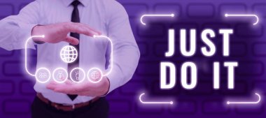 Sign displaying Just Do It, Internet Concept Motivation for starting doing something Have discipline Man With Futuristic Frame In Hands Showing Digital Display Of S.