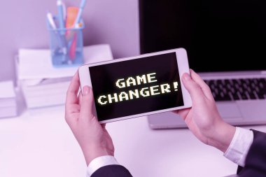 Conceptual caption Game Changer, Conceptual photo Sports Data Scorekeeper Gamestreams Live Scores Team Admins Sitting Businesswoman Holding Mobile Phone With Important Messages.