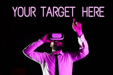 Text caption presenting Your Target Here, Word Written on Be focused on your goal objectives Strategy to succeed Businessman Using Virtual Reality Simulator And Gesturing During Training.