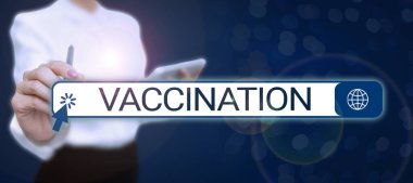 Conceptual display Vaccination, Concept meaning Treatment which makes the body stronger against infection Lady in suit holding pen symbolizing successful teamwork accomplishments.