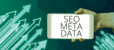 Text sign showing Seo Meta Data, Word Written on Search Engine Optimization Online marketing strategy Businessman Holding A Tablet On Hand With Arrows Going Up Abstract Design.
