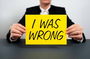 Inspiration showing sign I Was Wrong, Word Written on Acceptance of a mistake error Giving an apology Failure Businesswoman Holding Note With Important Message On Office Desk.