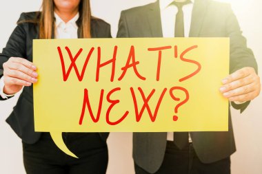 Conceptual caption What S Is New Question, Word for Asking about latest Updates Trends Happening News Business Team Holding Important Information On Speech Bubble On Both Sides.