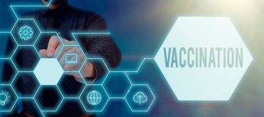 Hand writing sign Vaccination, Concept meaning Treatment which makes the body stronger against infection Lady in suit holding pen symbolizing successful teamwork accomplishments.