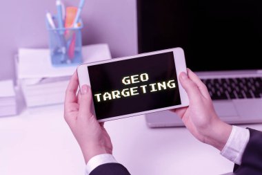 Conceptual caption Geo Targeting, Business showcase Digital Ads Views IP Address Adwords Campaigns Location Sitting Businesswoman Holding Mobile Phone With Important Messages.