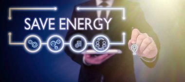 Writing displaying text Save Energy, Conceptual photo decreasing the amount of power used achieving a similar outcome Businessman in suit holding open palm symbolizing successful teamwork.