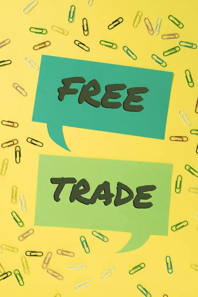 Text sign showing Free Trade, Business concept The ability to buy and sell on your own terms and means Colorful Paperclips Placed Around Two Speech Bubbles With Important News.