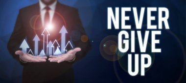 Text showing inspiration Never Give Up, Business concept Keep trying until you succeed follow your dreams goals Businessman in suit holding notepad symbolizing successful teamwork.