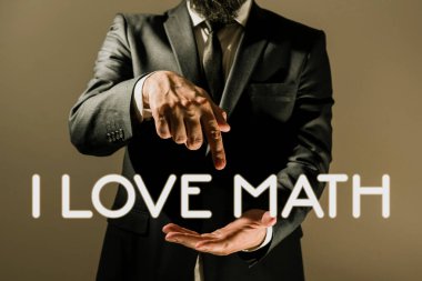 Inspiration showing sign I Love Math, Business showcase To like a lot doing calculations mathematics number geek person Businessman In Suit Pointing With One Finger On Important Message.