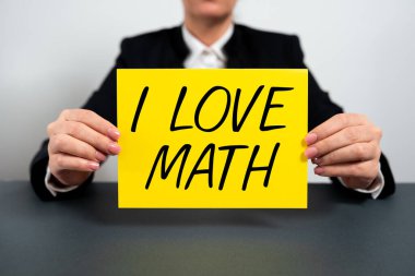 Hand writing sign I Love Math, Business concept To like a lot doing calculations mathematics number geek person Businesswoman Holding Note With Important Message On Office Desk.