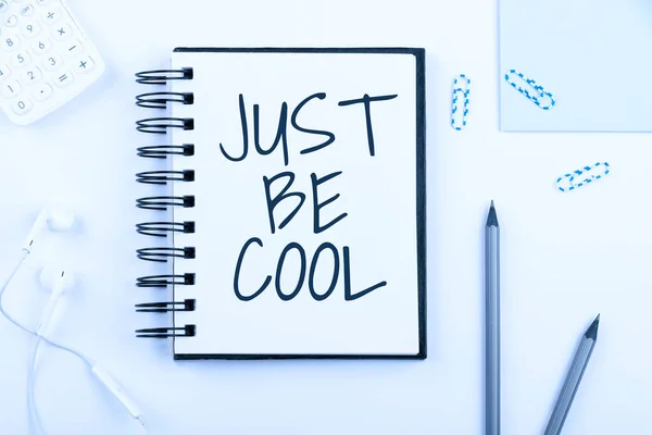 Writing displaying text Just Be Cool, Business showcase Have a good attitude be relaxed positive smile cheer you up Notebook With New Message On Desk With Pens, Headphones And Paperclips.