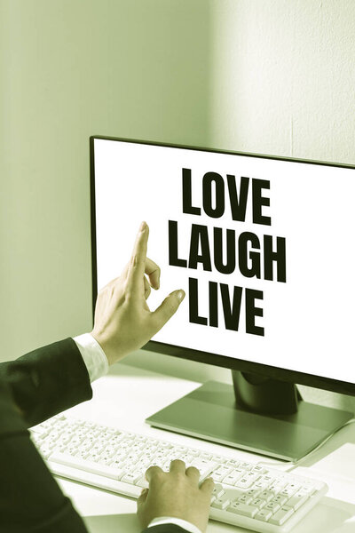 Inspiration showing sign Love Laugh Live, Word Written on Be inspired positive enjoy your days laughing good humor Woman Typing Updates On Lap Top And Pointing New Ideas With One Finger.