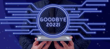 Inspiration showing sign Goodbye 2022, Business concept New Year Eve Milestone Last Month Celebration Transition Businessman With A Tablet Projecting Glowing Lines With Round Frame.