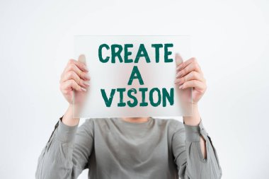 Sign displaying Create A Vision, Business concept Develop a strategy mission motivation purpose to achieve Woman Holding Banner And Promoting The Company Brand To Achieve Goals.